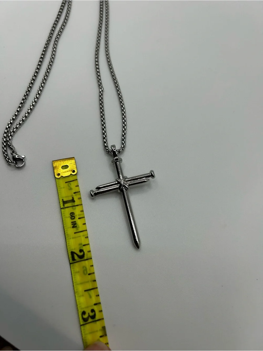 Stainless steel cross pendant necklace with textured detail